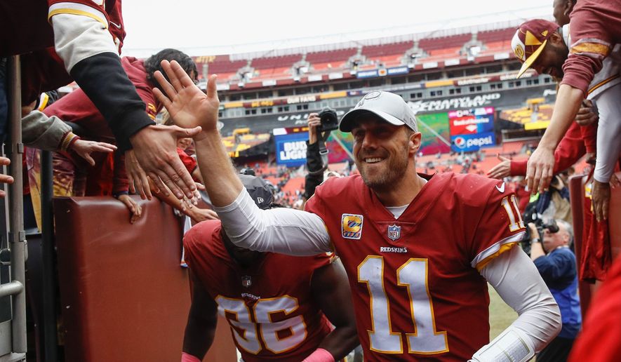 Redskins quarterback Alex Smith staked Washington to a two-touchdown lead in the first quarter and finished 21-for-36 passing for 163 yards in Sunday&#39;s victory over the Carolina Panthers. (Associated Press)