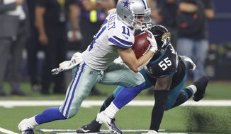 Dallas Cowboys wide receiver Cole Beasley (11) avoids a tackle by Jacksonville Jaguars defensive end Lerentee McCray (55) in the second half of an NFL football game in Arlington, Texas, Sunday, Oct. 14, 2018. (AP Photo/Jim Cowsert)