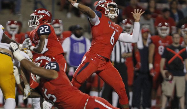Fresno State quarterback Marcus McMaryion throws a pass against Wyoming during the first half of an NCAA college football game in Fresno, Calif., Saturday, Oct. 13, 2018. (AP Photo/Gary Kazanjian)