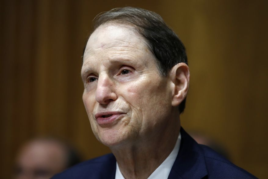 In this June 28, 2018, file photo, Sen. Ron Wyden, D-Ore., ranking member of the Senate Finance Committee, speaks during a hearing on the nomination of Charles Rettig for Internal Revenue Service Commissioner on Capitol Hill in Washington. Low-income people in states that haven't expanded Medicaid are much more likely to forgo needed medical care than the poor in other states, according to a government report due out Monday, Oct. 15, amid election debates from Georgia to Utah over coverage for the needy. (AP Photo/Jacquelyn Martin, File)