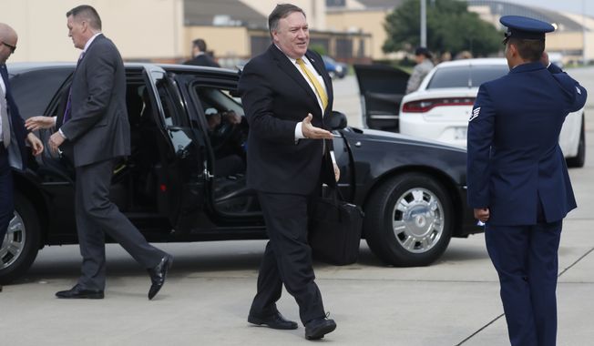 Secretary of State Mike Pompeo heads to his plane to depart for meetings with Saudi Arabia&#x27;s King Salman in Saudi Arabia, Monday, Oct. 15, 2018 at Andrews Air Force Base, Md. (Leah Millis/Pool Image via AP)