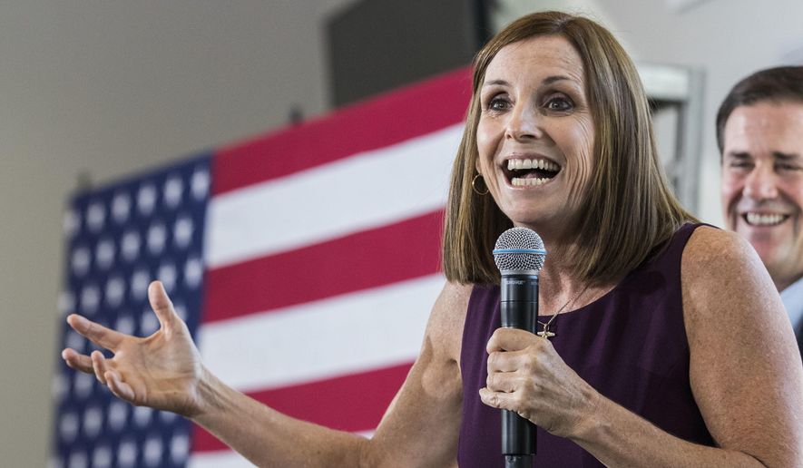 In this Oct. 12, 2018, file photo, U.S. Rep. Martha McSally, R-Ariz., addresses her constituents during a Get Out the Vote Rally in Gilbert, Ariz. (AP Photo/Darryl Webb, file)