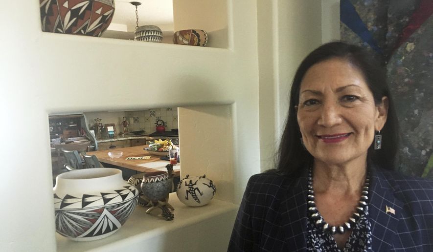 File - In this June 6, 2018, file photo, Deb Haaland, a Democratic candidate for Congress for central New Mexico&#39;s open seat and a tribal member of the Laguna Pueblo, speaks at her Albuquerque home. Three candidates for a key congressional district that encompasses New Mexico&#39;s most populated area are scheduled Monday, Oct. 15, 2018, to debate on their stances on the economy and other issues. (AP Photo/Russell Contreras, File)