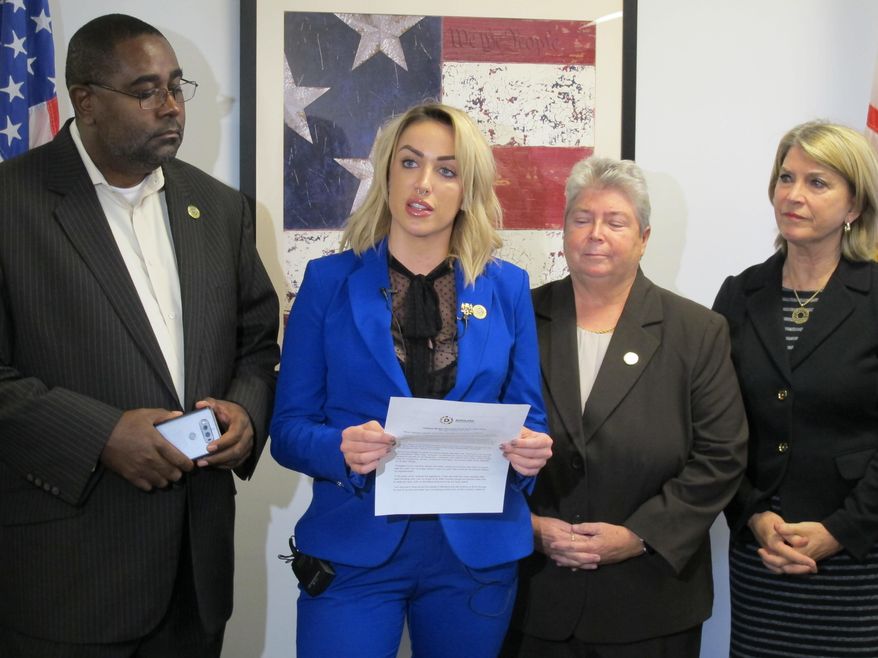 Meagan Simonaire, a Maryland state lawmaker, announces she is switching parties from Republican to Democrat on Monday, Oct. 15, 2018, in Annapolis, Md., partly because of President Donald Trump. Simonaire said she "can no longer remain a part of a party that condones his rhetoric" against women and minorities. Simonaire is standing with Del. Darryl Barnes, left, Del. Bonnie Cullison, and Kathleen Matthews, far left, who chairs the Maryland Democratic Party. (AP Photo/Brian Witte)