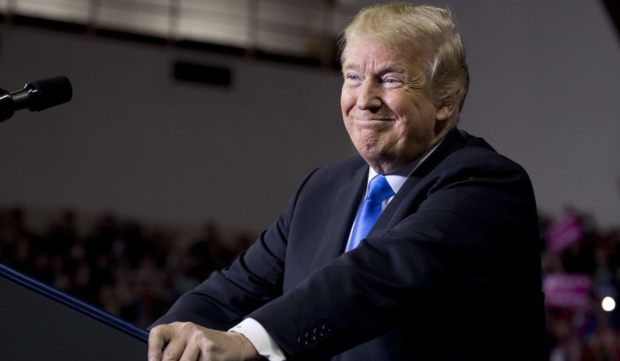 President Donald Trump smiles while speaking at a rally at Alumni Coliseum in Richmond, Ky., Saturday, Oct. 13, 2018. (AP Photo/Andrew Harnik)