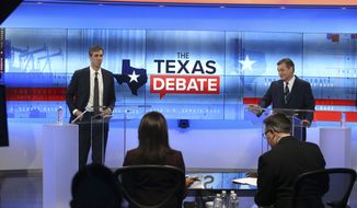 U.S. Rep. Beto O&#39;Rourke, D-Texas, left, and U.S. Sen. Ted Cruz, R-Texas, right, take part in a debate for the Texas U.S. Senate, Tuesday, Oct. 16, 2018, in San Antonio. (Tom Reel/San Antonio Express-News via AP, Pool)