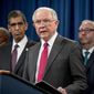 Attorney General Jeff Sessions, center, accompanied by Drug Enforcement Administration Acting Administrator Uttam Dhillon, center left, and other officials from the State Department, Treasury Department, Internal Revenue Service and Immigration and Customs Enforcement, speaks at a news conference to announce enforcement efforts against Cartel Jalisco Nueva Generacion, Tuesday, Oct. 16, 2018, at the Justice Department in Washington. (AP Photo/Andrew Harnik)