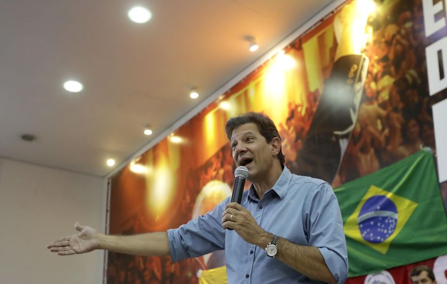 Fernando Haddad, Brazil&#x27;s presidential candidate for the Workers Party, speaks during a meeting with union leaders, in Sao Paulo, Brazil, Tuesday, Oct. 16, 2018. Haddad will face Jair Bolsonaro, the far-right congressman in a presidential runoff on Oct. 28. (AP Photo/Andre Penner)