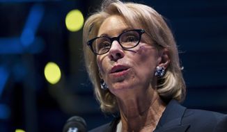 In this Sept. 17, 2018 photo, Education Secretary Betsy DeVos speaks during a student town hall at National Constitution Center in Philadelphia. A federal court has denied a request to delay an Obama-era regulation that helps students defrauded by for-profit colleges get their student loans forgiven.  (AP Photo/Matt Rourke) **FILE**