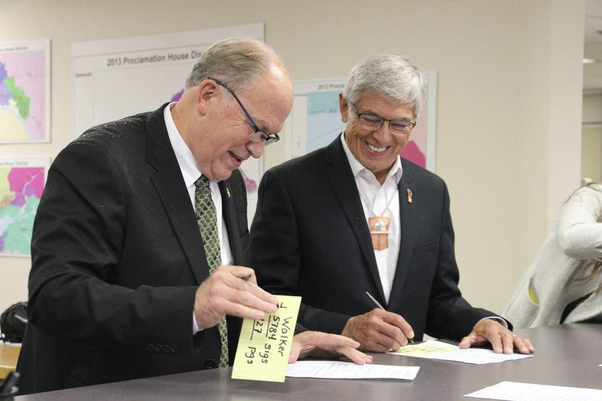 File - In this Aug. 20, 2018 file photo, Alaska Gov. Bill Walker, left, and Lt. Gov. Byron Mallott sign forms at the Division of Elections office in Anchorage, Alaska after the two men submitted signatures to get their ticket on the November general election ballot. The governor of Alaska says Lt. Gov. Byron Mallott has resigned over unspecified &amp;quot;inappropriate comments.&amp;quot; The move upends what was already a difficult re-election fight for Gov. Bill Walker. Mallott&#x27;s decision was announced Tuesday, Oct. 16, 2018, shortly after Walker participated in a debate in Anchorage. (AP Photo/Mark Thiessen, File)