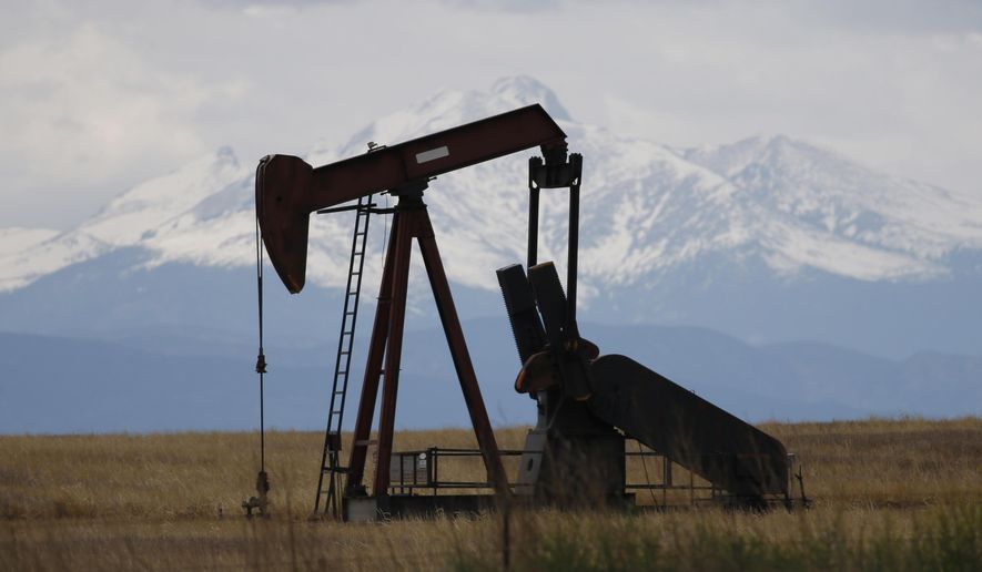 FILE - In this May 27, 2016, file photo, a pump jack works near Firestone, Colo. The Colorado Supreme Court is considering a high-stakes lawsuit over how much weight the state should give public health and the environment when regulating the oil and gas industry. (AP Photo/David Zalubowski, File)