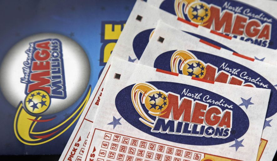 This July 1, 2016, file photo shows Mega Millions lottery tickets on a counter at a Pilot travel center near Burlington, N.C. (AP Photo/Gerry Broome, File)