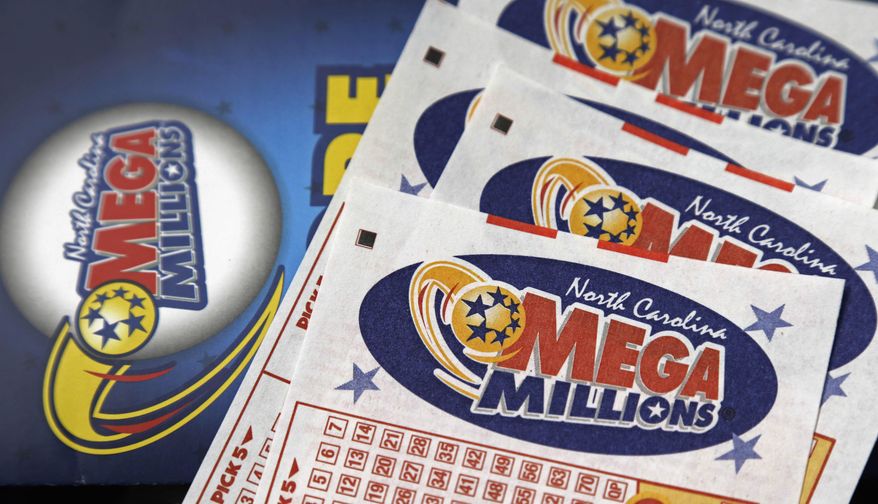 This July 1, 2016, file photo shows Mega Millions lottery tickets on a counter at a Pilot travel center near Burlington, N.C. (AP Photo/Gerry Broome, File)