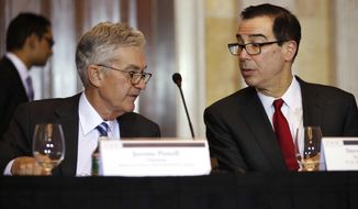 Treasury Secretary Steven Mnuchin, right, speaks with Federal Reserve Chairman Jerome Powell, at the start of a meeting of the Financial Stability Oversight Council, Tuesday, Oct. 16, 2018, at the Treasury Department in Washington. (AP Photo/Jacquelyn Martin) ** FILE **