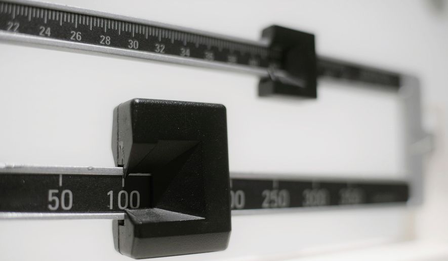 This April 3, 2018, file photo shows a closeup of a beam scale in New York. (AP Photo/Patrick Sison, File)