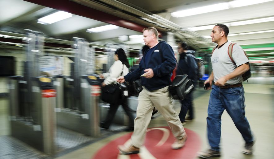 Commuters rush to board a PATCO train before the station at 16th Street and Locust Street closes in Philadelphia, Tuesday, Oct. 16, 2018. Power problems are forcing the closure of PATCO stations on Locust Street. The regional rail carrier says a fault in a power line provided by SEPTA is requiring emergency repairs at the stations. (AP Photo/Matt Rourke)
