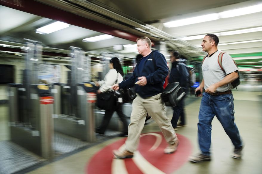 Commuters rush to board a PATCO train before the station at 16th Street and Locust Street closes in Philadelphia, Tuesday, Oct. 16, 2018. Power problems are forcing the closure of PATCO stations on Locust Street. The regional rail carrier says a fault in a power line provided by SEPTA is requiring emergency repairs at the stations. (AP Photo/Matt Rourke)