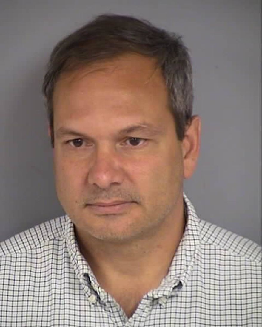 This undated photo provided by the las Vegas Department of Public Safety shows Wilfred Michael Stark, 50, of Falls Church, Va. Authorities say Stark was arrested Tuesday, Oct. 16, 2018, on a misdemeanor battery charge after he was accused of pushing into a Republican party event and grabbing the manager of Nevada state Attorney General Adam Laxalts gubernatorial campaign. (Las Vegas Department of Public Safety via AP)