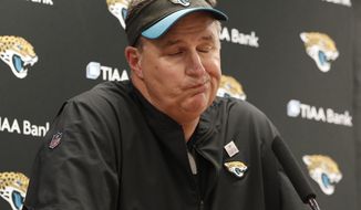 FILE - In this Sunday, Oct. 14, 2018, file photo, Jacksonville Jaguars head coach Doug Marrone talks with the media following an NFL football game against the Dallas Cowboys in Arlington, Texas. The Jaguars are back in training camp mode after consecutive lopsided losses. Coach Doug Marrone says they will spend the week working on fundamentals in hopes of trying “to correct a lot of bad football that we have been playing.” (AP Photo/Jim Cowsert, File)