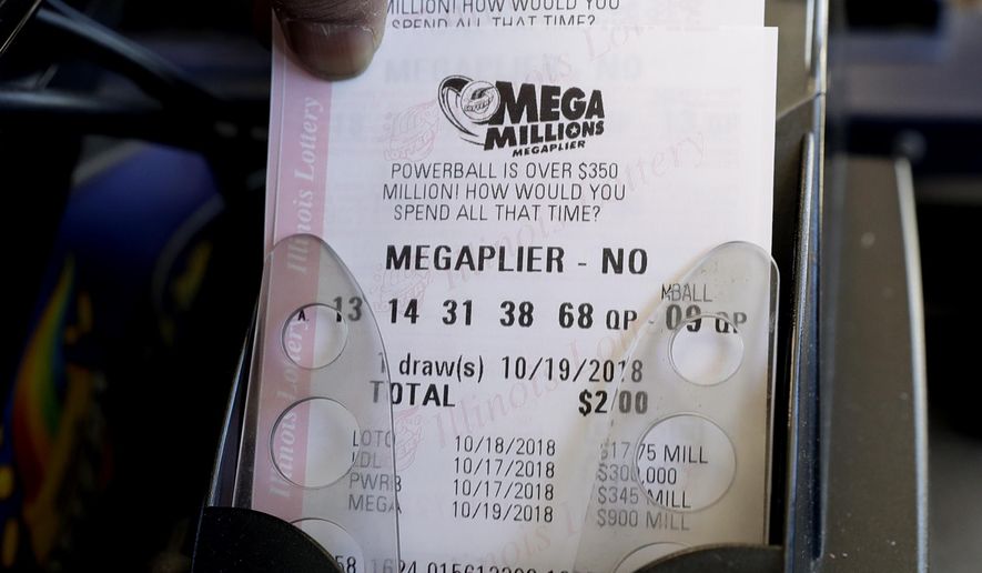 Mega Millions lottery tickets are printed out of a lottery machine at a convenience store Wednesday, Oct. 17, 2018, in Chicago. The estimated jackpot for Friday's drawing would be the second-largest lottery prize in U.S. history with a jackpot estimated to exceed $900 million. (AP Photo/Nam Y. Huh)