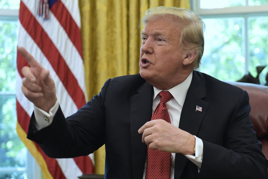 President Donald Trump speaks in the Oval Office of the White House in Washington, Wednesday, Oct. 17, 2018, during a meeting with workers. The meeting with workers was on, "Cutting the Red Tape, Unleashing Economic Freedom." (AP Photo/Susan Walsh)