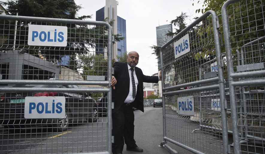 A guard secures the entrance of the Saudi Arabia's Consulate in Istanbul, Wednesday, Oct. 17, 2018. U.S. Secretary of State Mike Pompeo has landed in Turkey Wednesday to discuss the Oct. 2, unexplained disappearance and alleged slaying of Saudi writer Jamal Khashoggi with authorities.(AP Photo/Petros Giannakouris)