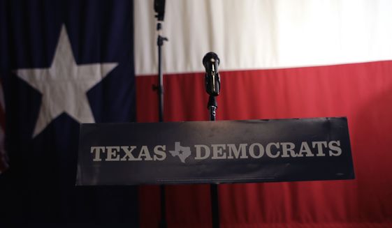 A Texas Democrats sign hangs on a podium at a Democratic watch party following the Texas primary election, Tuesday, March 6, 2018, in Austin, Texas. (AP Photo/Eric Gay)