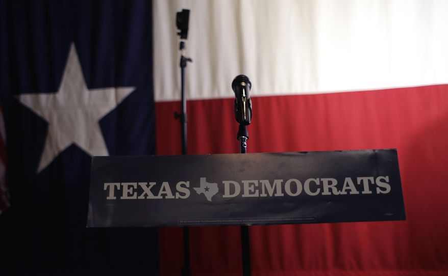 A Texas Democrats sign hangs on a podium at a Democratic watch party following the Texas primary election, Tuesday, March 6, 2018, in Austin, Texas. (AP Photo/Eric Gay)