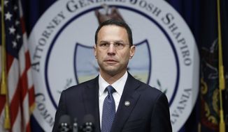 FILE - In this Aug. 14, 2018, file photo, Pennsylvania Attorney General Josh Shapiro speaks about a grand jury’s report on clergy abuse in the Roman Catholic Church during a news conference at the Capitol in Harrisburg, Pa. The U.S. Justice Department opened their own investigation and have served subpoenas on dioceses across the state, according to multiple sources who spoke to The Associated Press on condition of anonymity. The subpoenas follow the state grand jury report. (AP Photo/Matt Rourke, File)