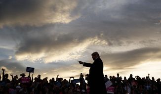 President Donald Trump arrives as the sun sets to speak at a campaign rally at Minuteman Aviation Hangar, Thursday, Oct. 18, 2018, in Missoula, Mont. (AP Photo/Carolyn Kaster)
