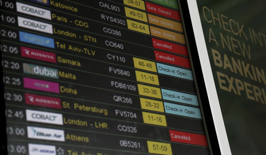 Airport departure board showing the Cobalt flights cancelled at Larnaca international airport, Cyprus, Thursday, Oct. 18, 2018. Cyprus-based airline Cobalt Air says it has indefinitely suspended all of its operations Thursday, amid a struggle to find investors. (AP Photo/Petros Karadjias)
