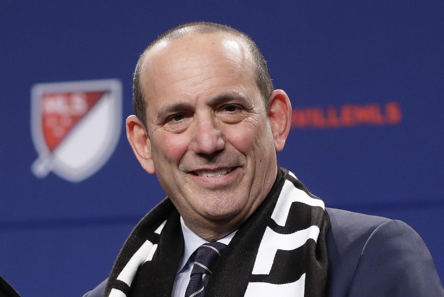 FILE - In this Dec. 20, 2017, file photo, Major League Soccer commissioner Don Garber smiles during a press conference in Nashville, Tenn.,  where it was announced that Nashville was awarded an MLS franchise. Now nearing two decades at the helm of MLS, Garber guides an ever-expanding league that is set to grow to 26 teams by 2020. Garber will be enshrined in the National Soccer Hall of Fame this weekend. (AP Photo/Mark Humphrey, File)