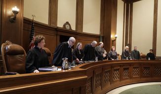 FILE - In this June 28, 2018, file photo, the justices of the Washington Supreme Court take their seats at the start of a session in Olympia, Wash. A split Washington state Supreme Court on Thursday, Oct. 18, 2018, barred the state from sentencing 16- and 17-year-old murder defendants to life in prison without the possibility of parole, saying the sentence violates the state Constitution&#39;s ban on cruel punishment. (AP Photo/Ted S. Warren, File)