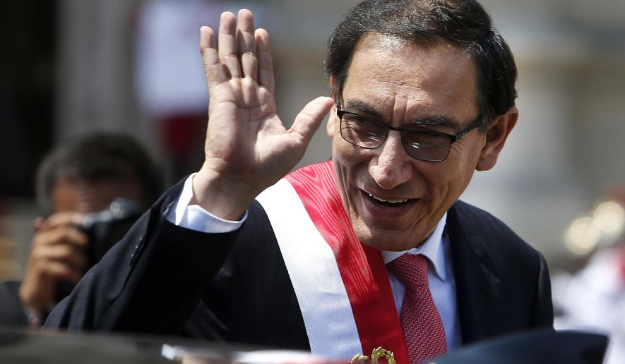 FILE - In tis March 23, 2018 file photo, Peru&#39;s newly-sworn in President Martin Vizcarra waves as he makes his way to the House of Pizarro, the presidential residence and workplace, also known as Government Palace, in Lima, Peru. Vizcarra, a soft-spoken engineer stepped into Peru&#39;s presidency earlier this year after his predecessor resigned amid scandal. (AP Photo/Karel Navarro, File)