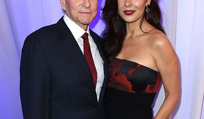 Michael Douglas born 1944 and Catherine Zeta-Jones, born 1969, Age Difference: 25 years       Michael Douglas, left, and Catherine Zeta-Jones attend AARP&#x27;s 15th Annual Movies for Grownups Awards at the Beverly Wilshire Hotel on Monday, Feb. 8, 2016, in Beverly Hills, Calif. (Photo by Jordan Strauss/Invision for AARP/AP Images)