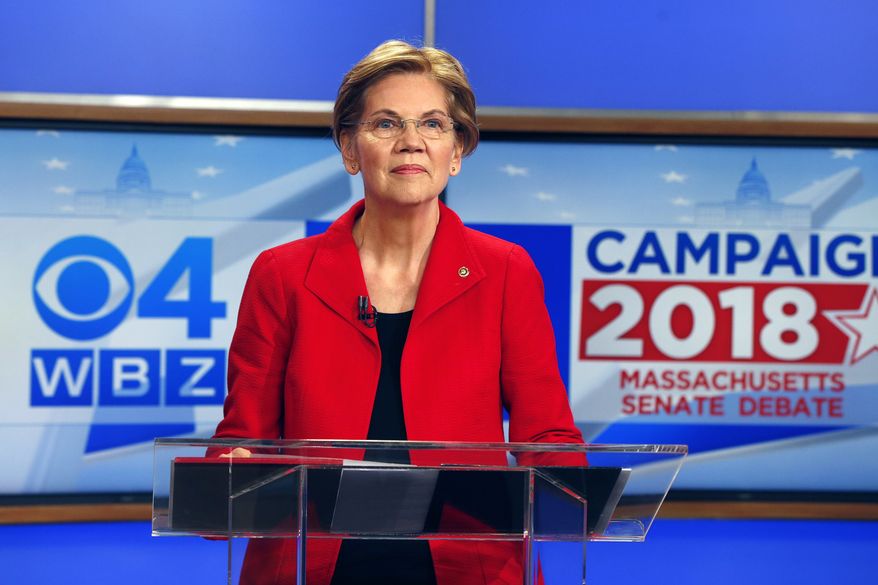 Democratic candidate for U.S. Senate from Massachusetts, incumbent Elizabeth Warren stands at the podium before a debate with her opponent Geoff Diehl in Boston, Friday, Oct. 19, 2018. (AP Photo/Michael Dwyer)