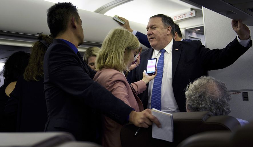 Secretary of State Mike Pompeo speaks with reporters in his plane while flying from Panama to Mexico, Thursday, Oct. 18, 2018.  (Brendan Smialowski/Pool Image via AP)