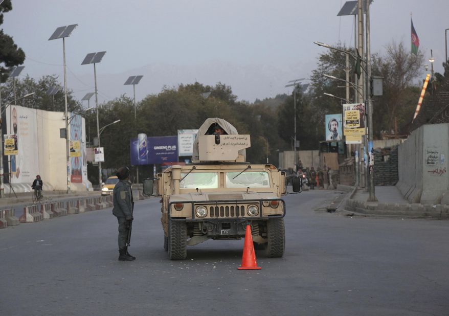 Afghan security personnel stand guard on the day of the parliamentary election in Kabul, Afghanistan, Saturday, Oct. 20, 2018. (AP Photo/Rahmat Gul)