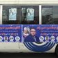 In this Tuesday Oct. 16, 2018, file photo, a bus is covered with posters for candidate, Alhaj Abdul Hossain Hossainzada, ahead of parliamentary elections, in Kabul, Afghanistan. The elections are being held Saturday despite deep security concerns and ongoing fighting in as many as 20 out of the country’s 34 provinces. The vote comes amid a particularly vicious campaign by the Taliban and the Islamic State group, which have been staging near-daily attacks and there have also been concerns over the transparency of the vote. (AP Photo/Rahmat Gul)