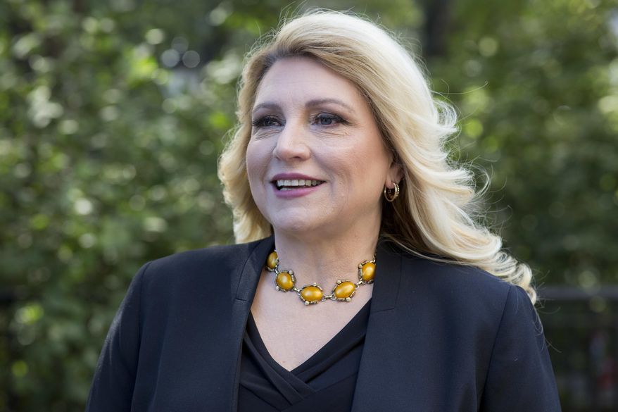 Radio personality Delilah poses for a portrait in New York on Thursday, Oct. 18, 2018, to promote her memoir, "One Heart at a Time." (AP Photo/Mark Lennihan)
