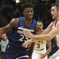 Minnesota Timberwolves&#39; Jimmy Butler, left, drives around Cleveland Cavaliers&#39; Kevin Love in the first half of an NBA basketball game Friday, Oct. 19, 2018, in Minneapolis. (AP Photo/Jim Mone)