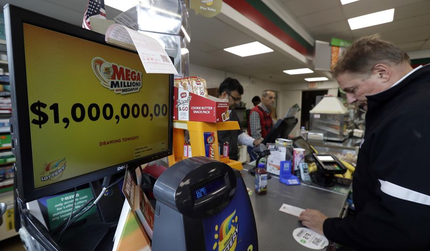 A sign displays the estimated Mega Millions jackpot at a convenience store in Chicago, Friday, Oct. 19, 2018. Friday's jackpot has soared to $1 billion, the second-largest prize in U. S. lottery history. (AP Photo/Nam Y. Huh)