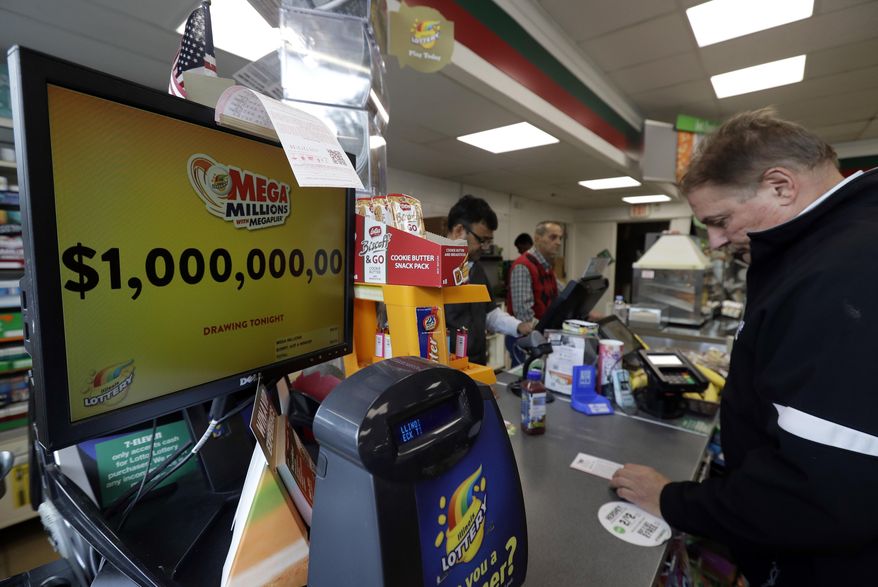 A sign displays the estimated Mega Millions jackpot at a convenience store in Chicago, Friday, Oct. 19, 2018. Friday's jackpot has soared to $1 billion, the second-largest prize in U. S. lottery history. (AP Photo/Nam Y. Huh)