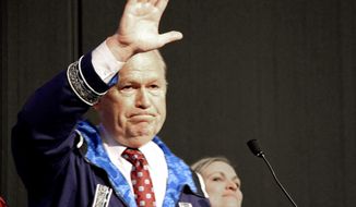 Alaska Gov. Bill Walker waves as he announces he will drop his re-election bid while addressing the Alaska Federation of Natives conference Friday, Oct. 19, 2018, in Anchorage, Alaska. Walker&#39;s re-election plans were dealt a blow earlier in the week after his running mate, Lt. Gov. Byron Mallott, resigned after making an inappropriate overture toward a woman. (AP Photo/Mark Thiessen)