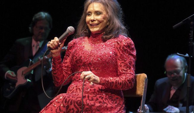 FILE - In this Aug. 28, 2016 file photo, Loretta Lynn performs in concert at the American Music Theater in Lancaster, Pa. Lynn says she is doing better after a brief hospital visit to treat an illness that kept her from attending a CMT tribute to her and other female country artists. A message posted on Lynn&#x27;s official Facebook page Saturday afternoon, Oct. 20, 2018, said she is feeling better and is now resting at home. (Photo by Owen Sweeney/Invision/AP, File)