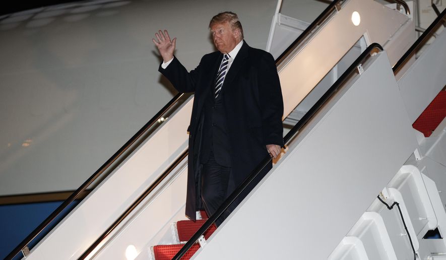 President Donald Trump dismbarks from Air Force One, Saturday, Oct. 20, 2018, in Andrews Air Force Base, Md., en route to Washington returning from a campaign rally in Elko, Nev. (AP Photo/Carolyn Kaster)