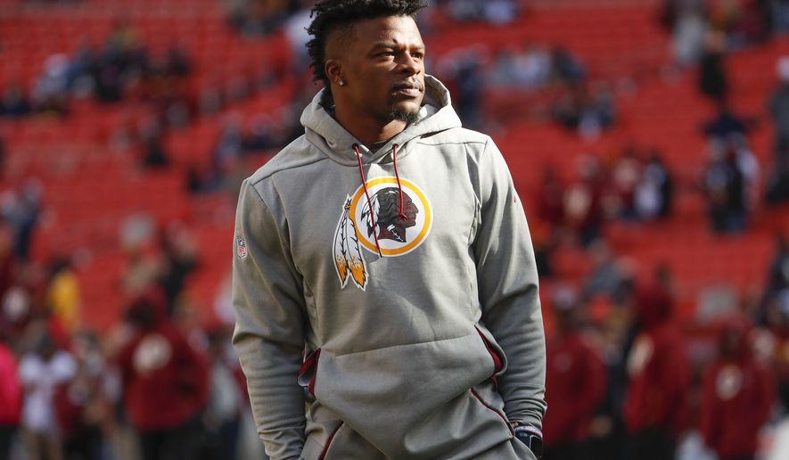 Washington Redskins running back Chris Thompson (25) walks across the field before an NFL football game between the Washington Redskins and the Dallas Cowboy, Sunday, Oct. 21, 2018 in Landover, Md. (AP Photo/Andrew Harnik)