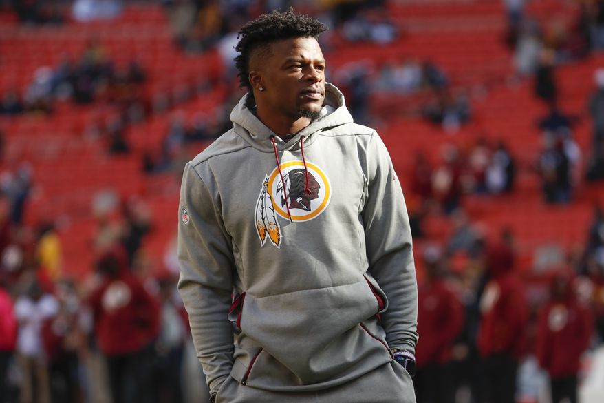 Washington Redskins running back Chris Thompson (25) walks across the field before an NFL football game between the Washington Redskins and the Dallas Cowboy, Sunday, Oct. 21, 2018 in Landover, Md. (AP Photo/Andrew Harnik)