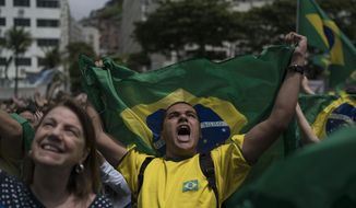 A man yells after listening to the Brazil&#x27;s anthem during a campaign rally for presidential candidate Jair Bolsonaro, of the far-right Social Liberal Party, in Copacabana in Rio de Janeiro, Brazil, Sunday, Oct. 21, 2018. The rally took place one week before Brazilians return to the polls on Oct. 28 for a second round of voting. (AP Photo/Leo Correa)