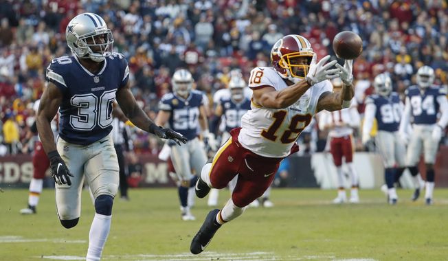 Washington Redskins wide receiver Josh Doctson (18) reaches for an incomplete pass as Dallas Cowboys cornerback Anthony Brown (30) looks on during the first half of an NFL football game, Sunday, Oct. 21, 2018, in Landover, Md. (AP Photo/Andrew Harnik) ** FILE **